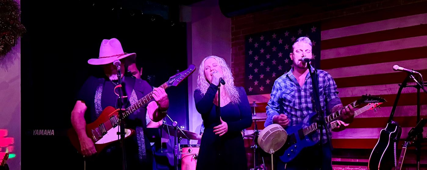 The Straight A’s Band performing for an event crowd