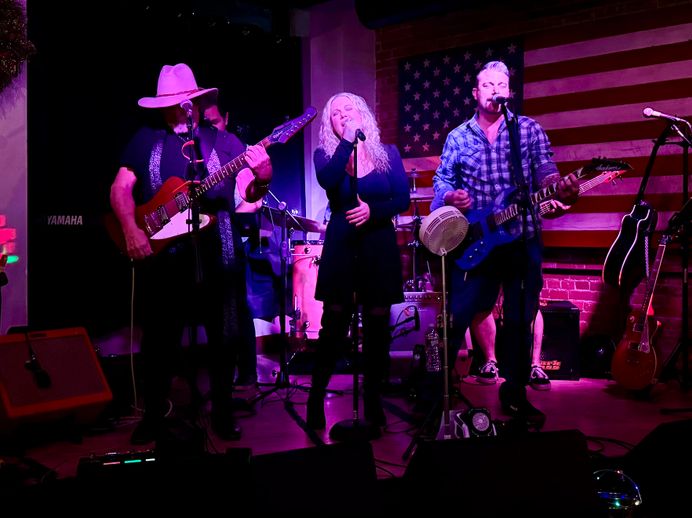 Straight A’s musicians playing a high-energy cover band set