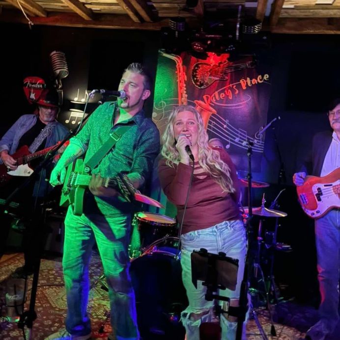 The Straight A’s Band performing live for a packed crowd