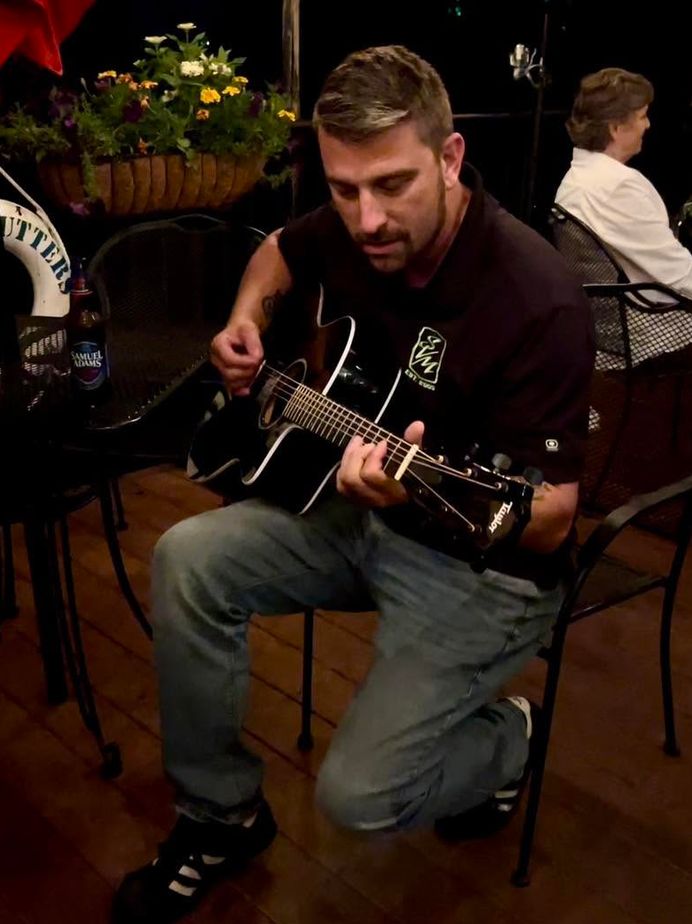 Straight A’s musicians playing a high-energy cover band set